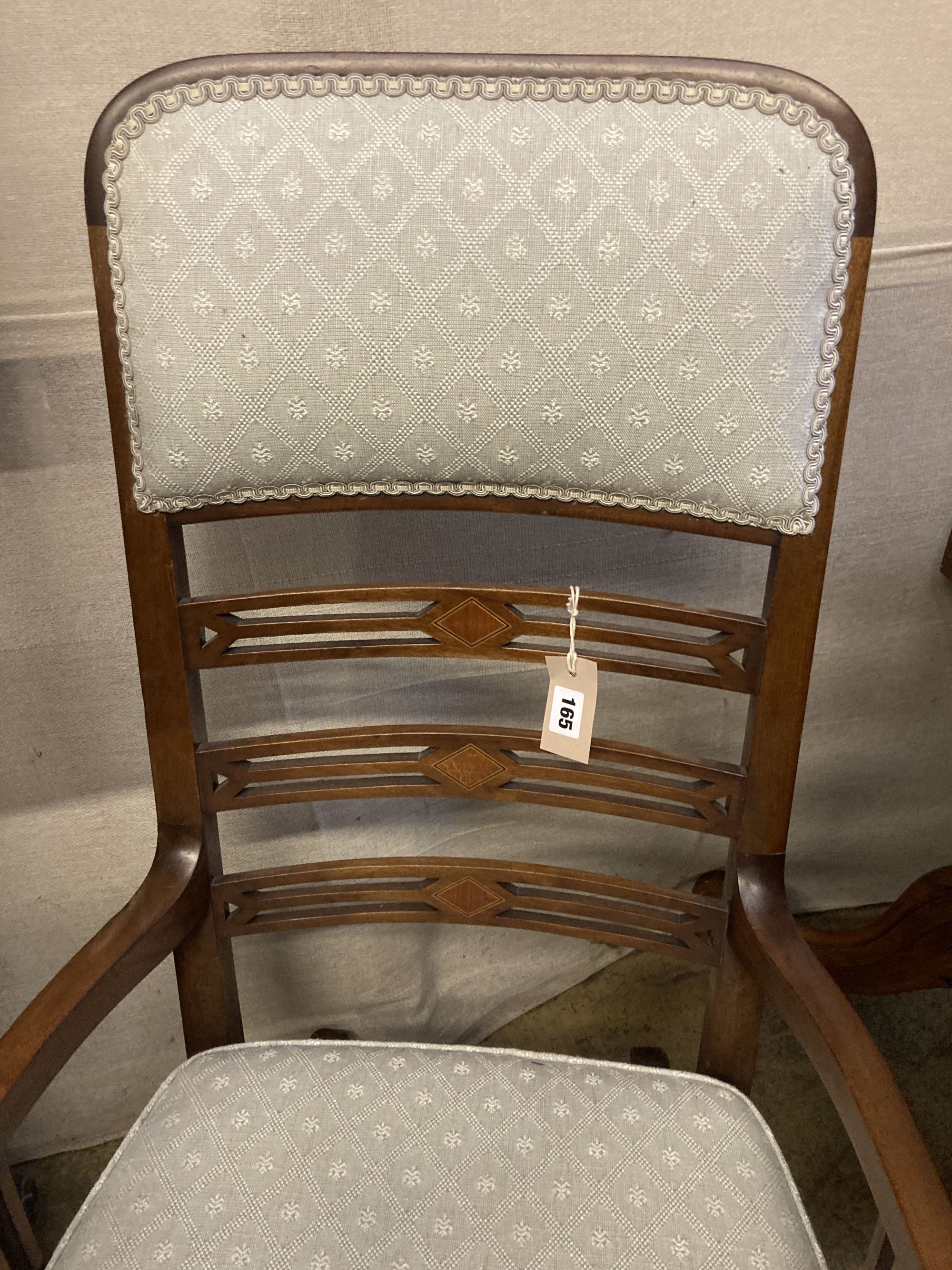 An Edwardian satinwood banded mahogany rocking chair